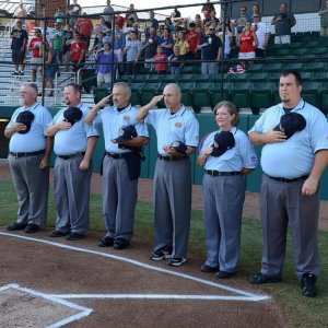 Umpire standing during national anthem